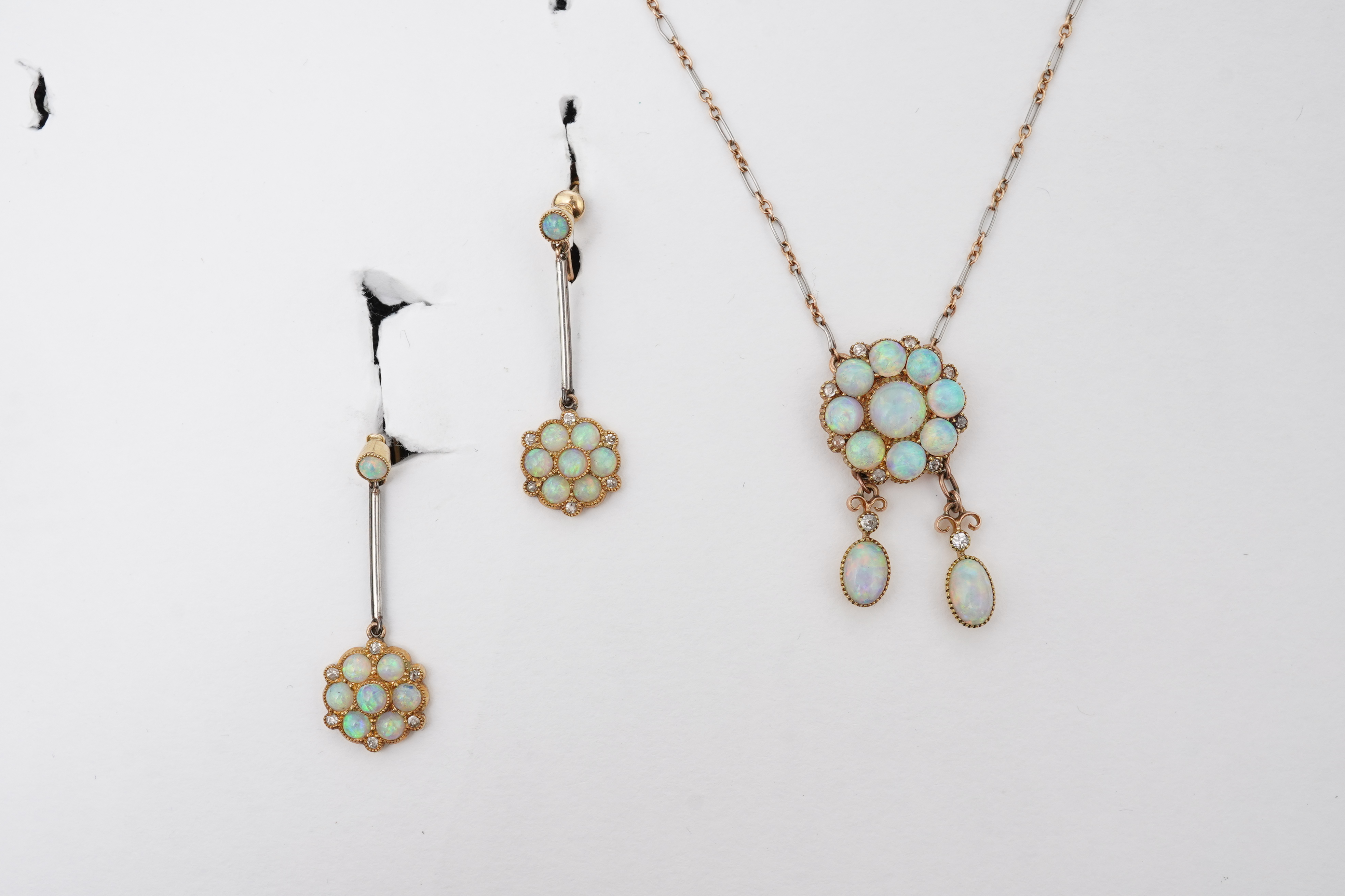 An attractive Edwardian opal and diamond demi-parure, early 20th century